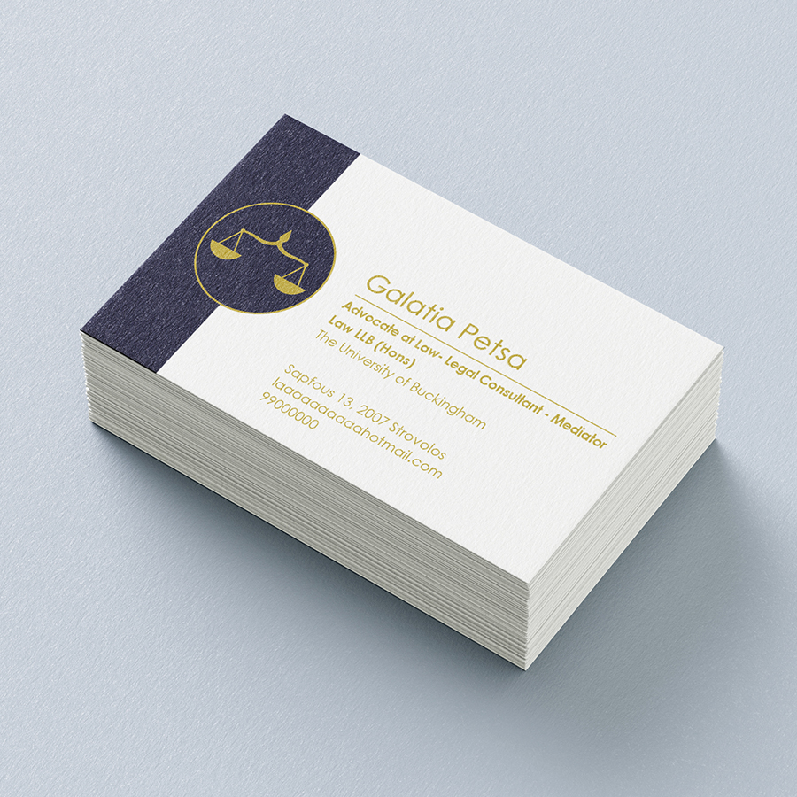 Stack of business cards on a light blue background. Cards have a blue line with a gold scale in a circle on the left side and gold text over white on the right side.